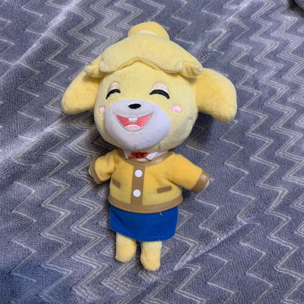 Nintendo. Animal crossing  7+, plushy. 9.5hx4w. Yellow. good used condition.